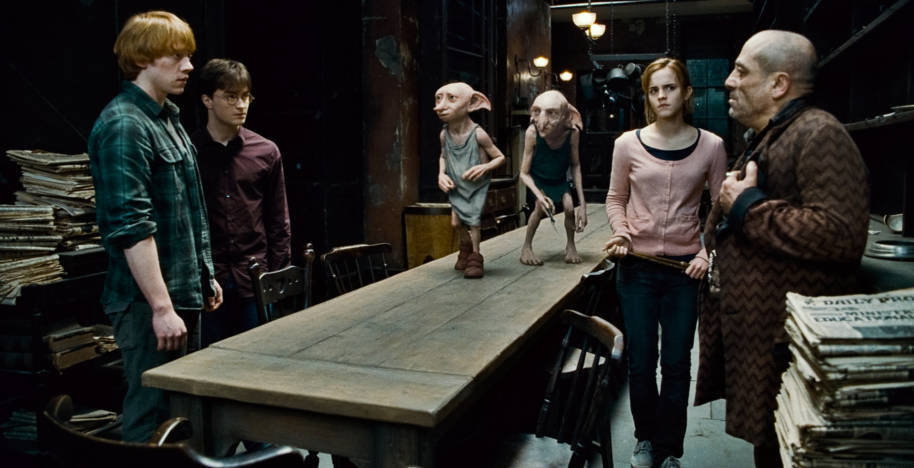 Dobby and Kreacher deilver Mundungus to Ron, Hermione and Harry in Grimmauld Place.