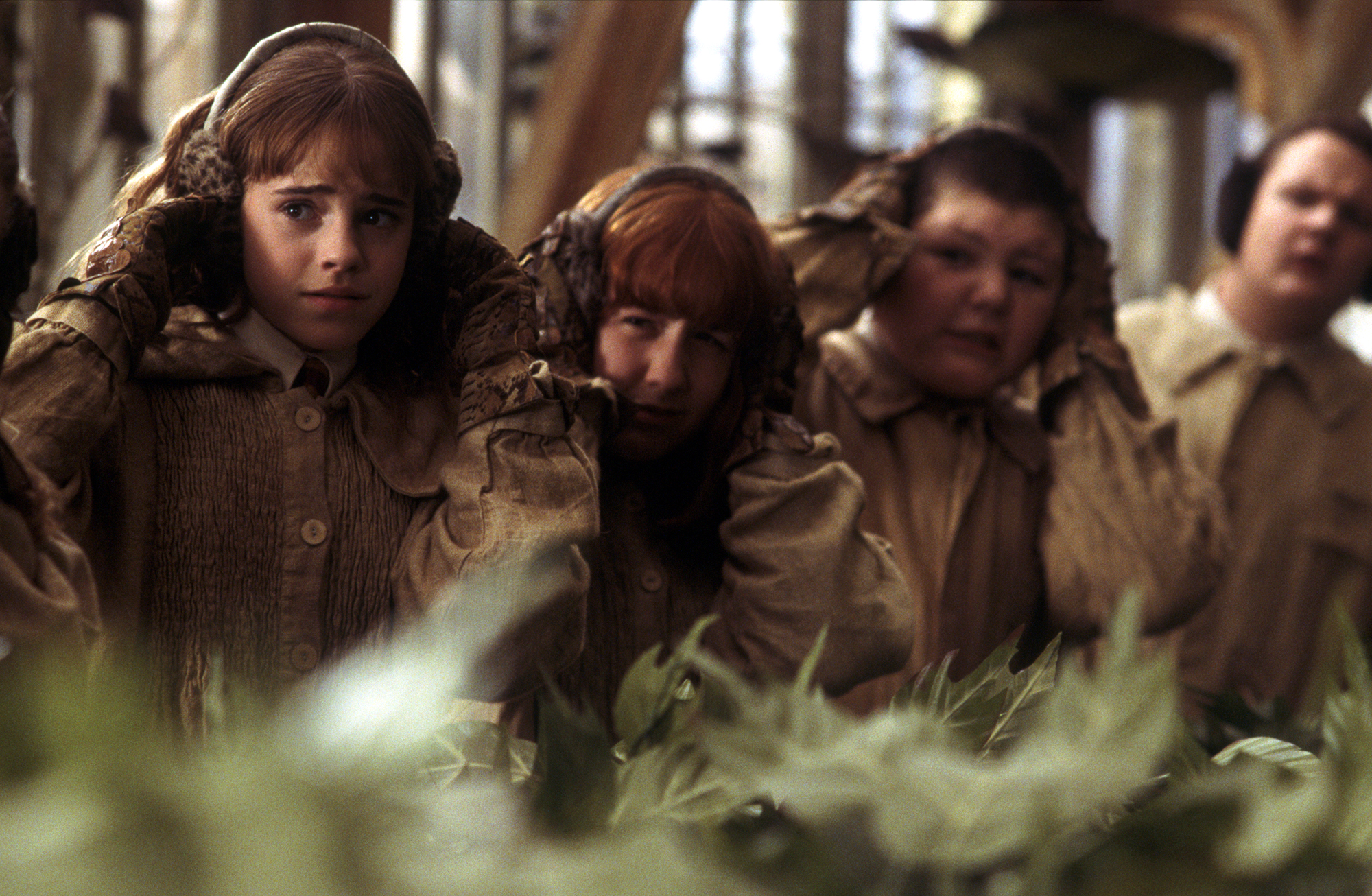 WB-HP-F2-Chamber-of-Secrets-hermione-and-students-wear-earmuffs-in-greenhouse-herbology