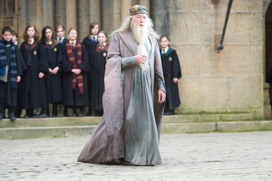 Albus Dumbledore walking across the courtyard at Hogwarts