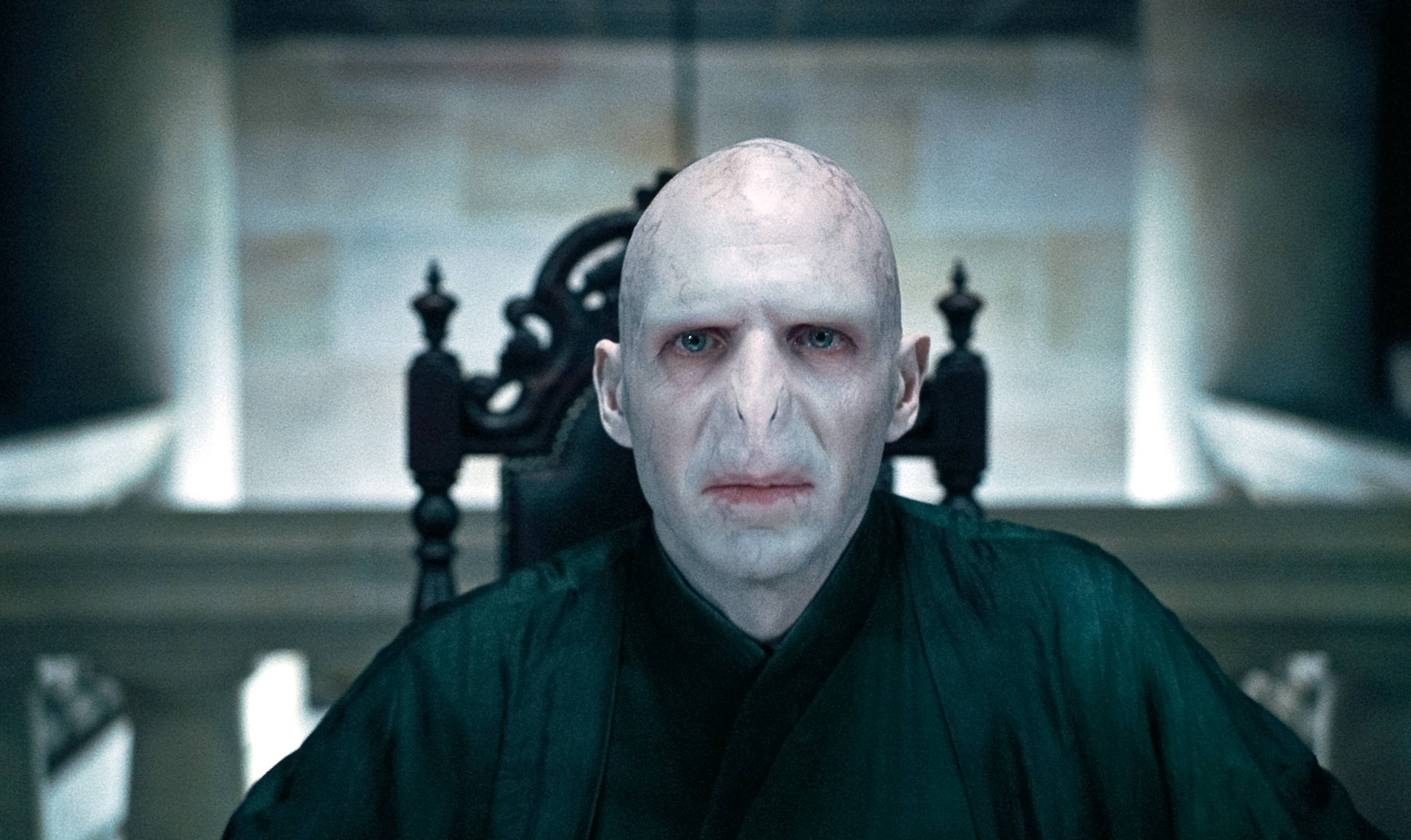 Voldemort stares ahead while in Malfoy Manor in a film still from the Deathly Hallows Part .