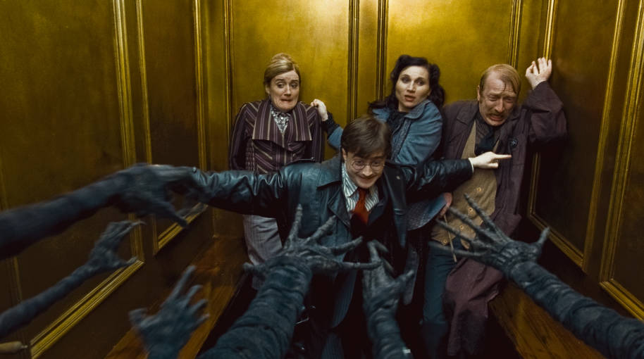 Harry, Ron, Hermione and Mrs Cattermole escaping the Dementors in the Ministry of Magic in the lift. Hermione and Ron are still disguised as Reg Cattermole and Mafalda Hopkirk