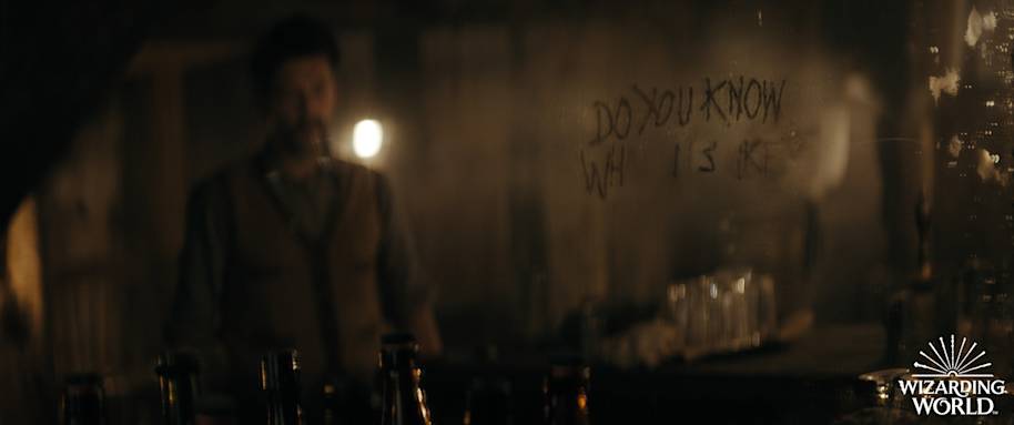 Aberforth is in the background and a message is written in front of him