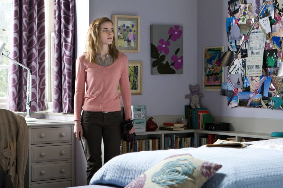 Hermione Granger standing in her childhood bedroom looking sad