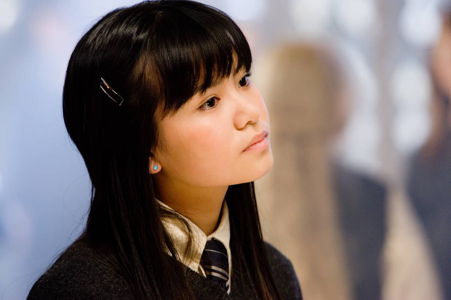 A close-up of Cho Chang's face. She looks thoughtful.