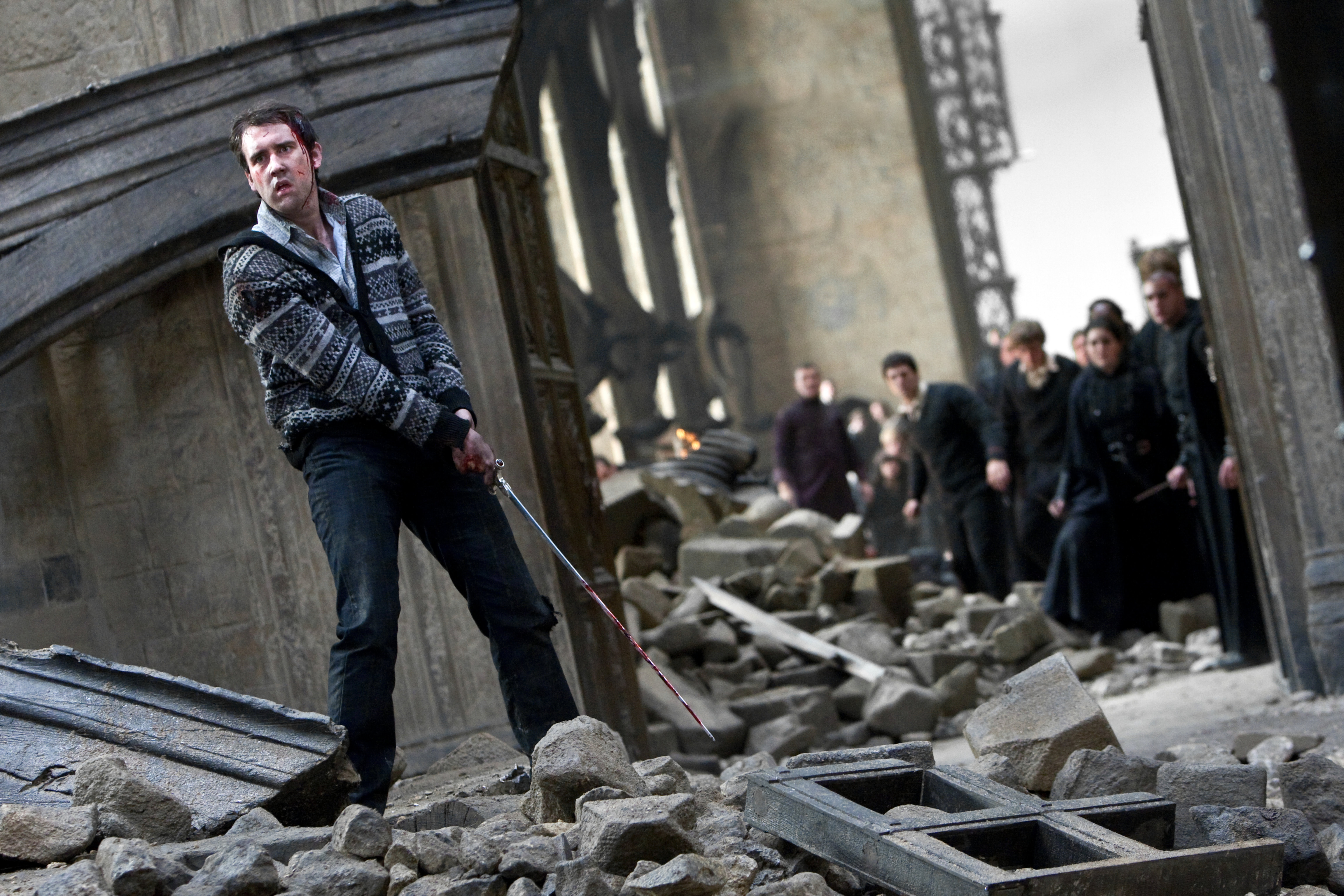 NevilleLongbottom WB F8 NevilleHoldingSwordOfGryffindorAtHogwarts Still 100615 Land