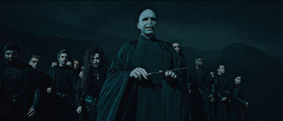 Voldemort is stood in the forefront and is flanked either side by several Death Eaters including Bellatrix Lestrange