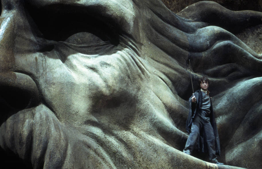 WB-HP-F2-chamber-of-secrets-harry-on-slytherin-statue