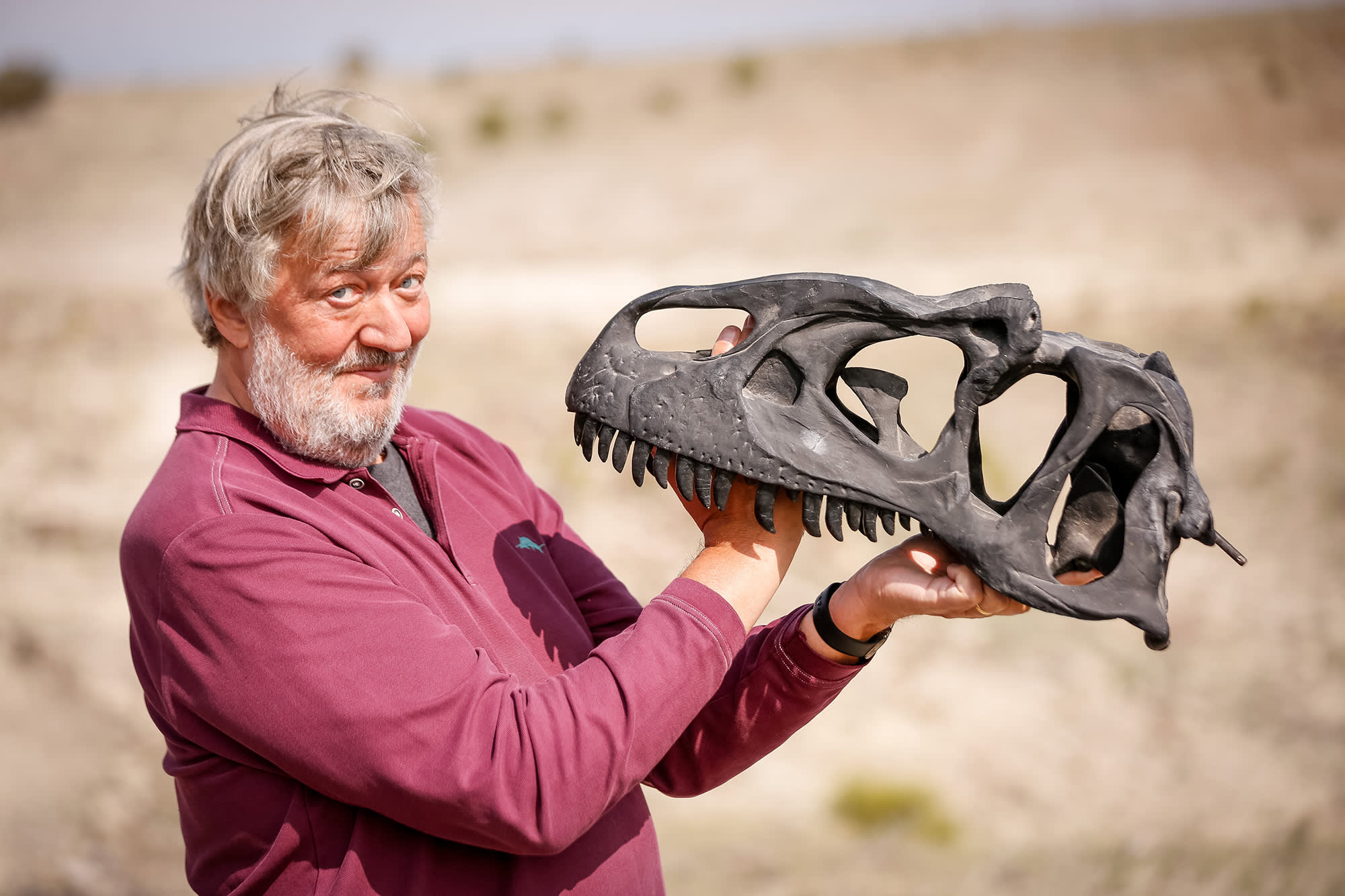 Stephen Fry holding an animal skull