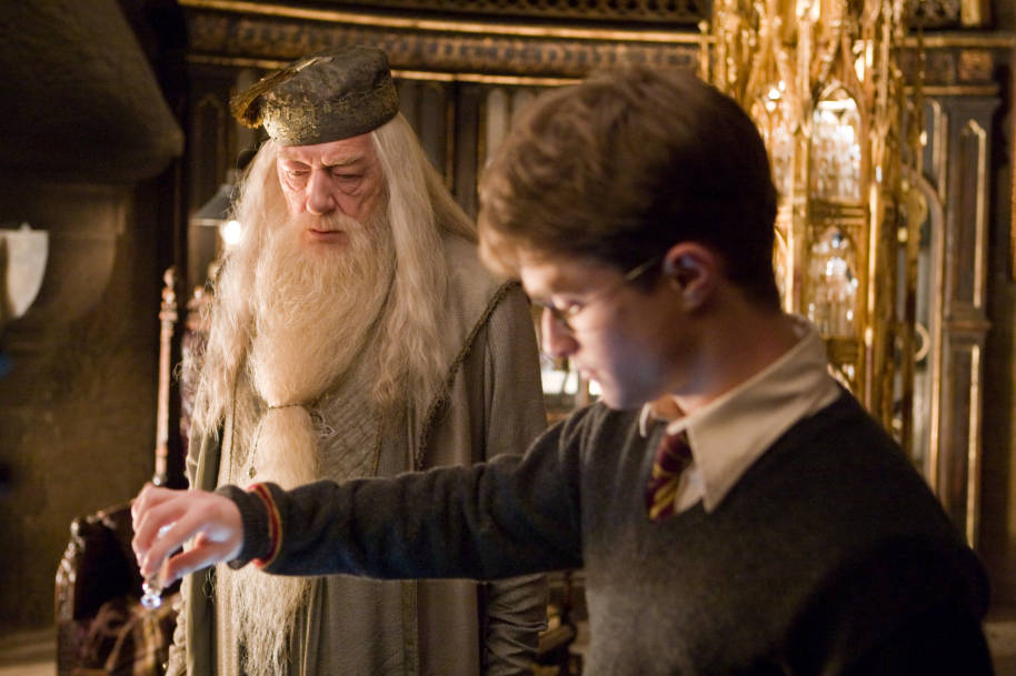 Dumbledore and Harry stand near the Pensieve in the Half Blood Prince