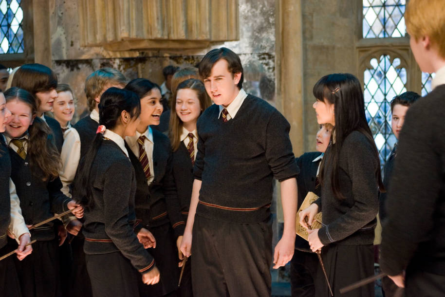 Neville is celebrated by friends during Dumbledore's Army training at Hogwarts.