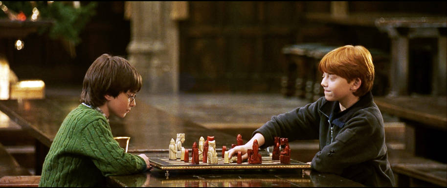 HP-F1-philosophers-stone-harry-ron-playing-chess-great-hall-web-landscape