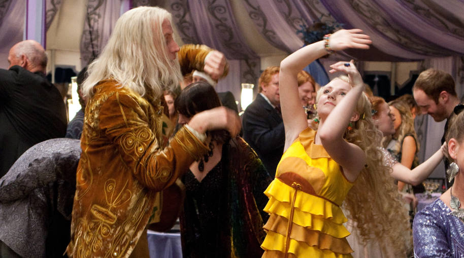 Luna and Xenophilius Lovegood doing an eccentric dance together at Bill and Fleur's wedding
