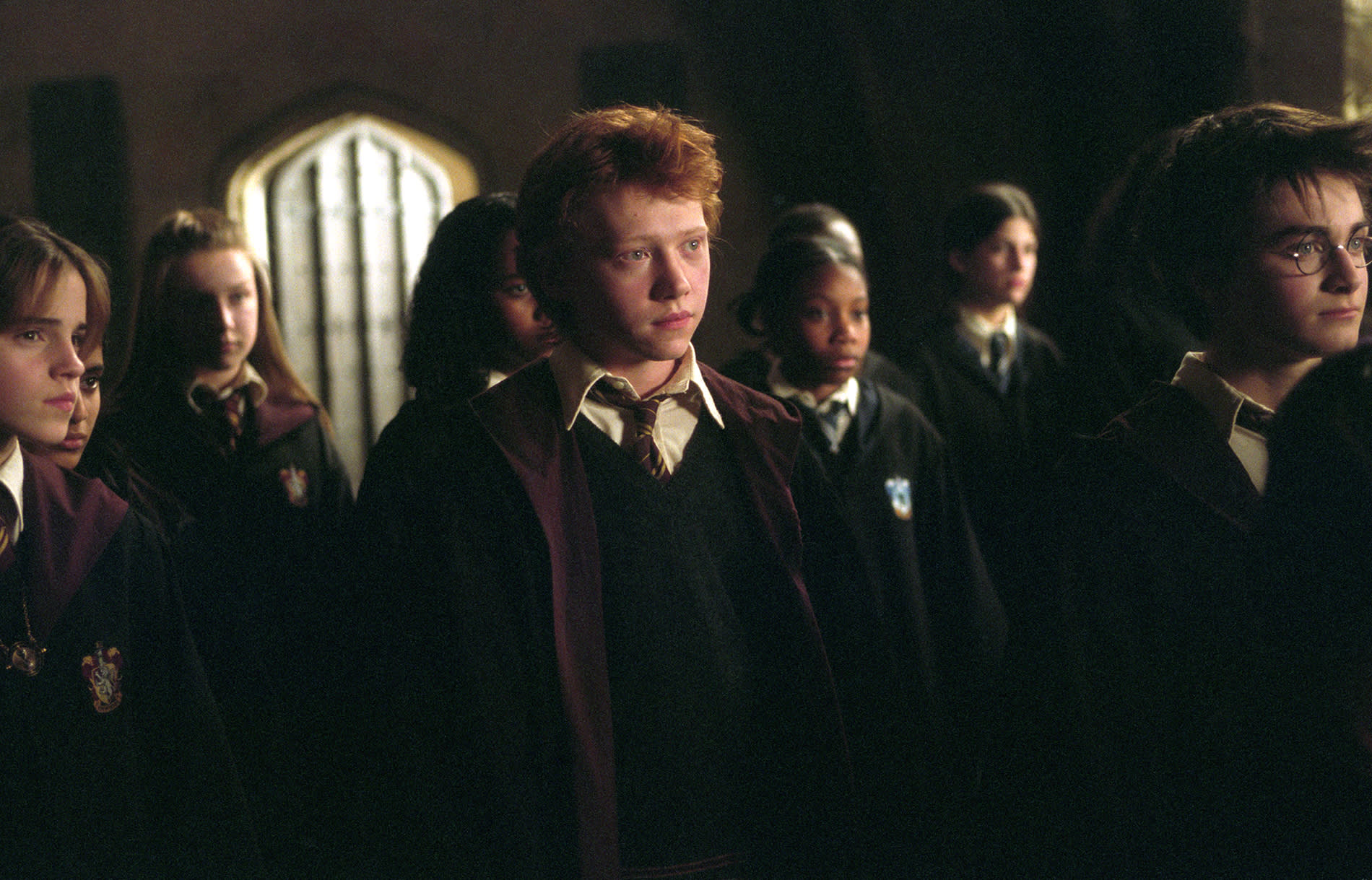 WB-HP-F3-hermione-ron-and-harry-among-other-students-web-landscape