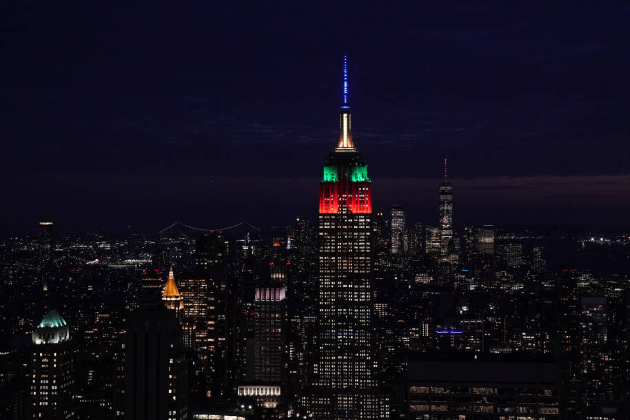 The Empire State Building lit up with the four Hogwarts house colours.