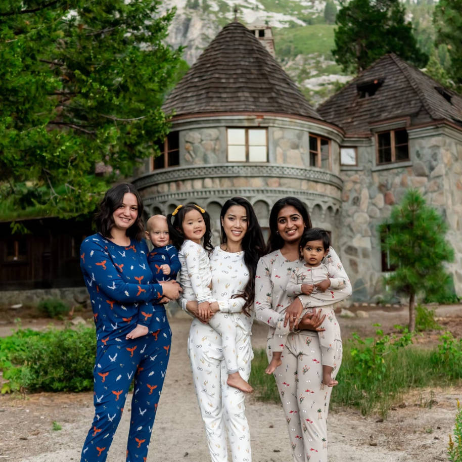 Models and young children modelling Harry Potter-themed sleepwear.