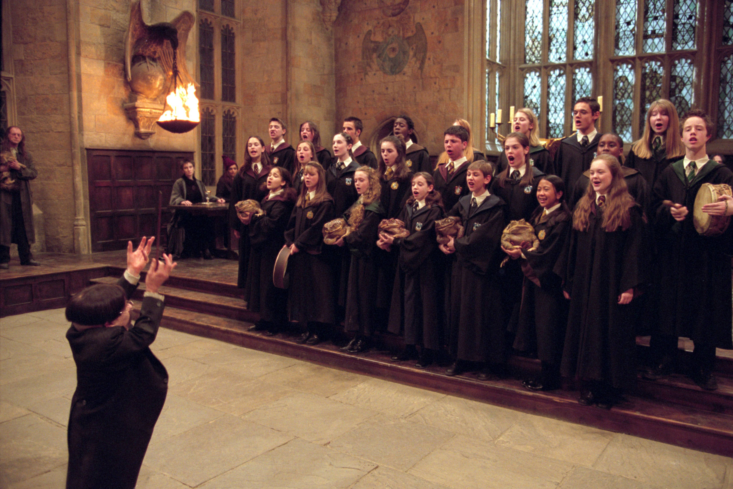 Flitwick conducts the school choir.