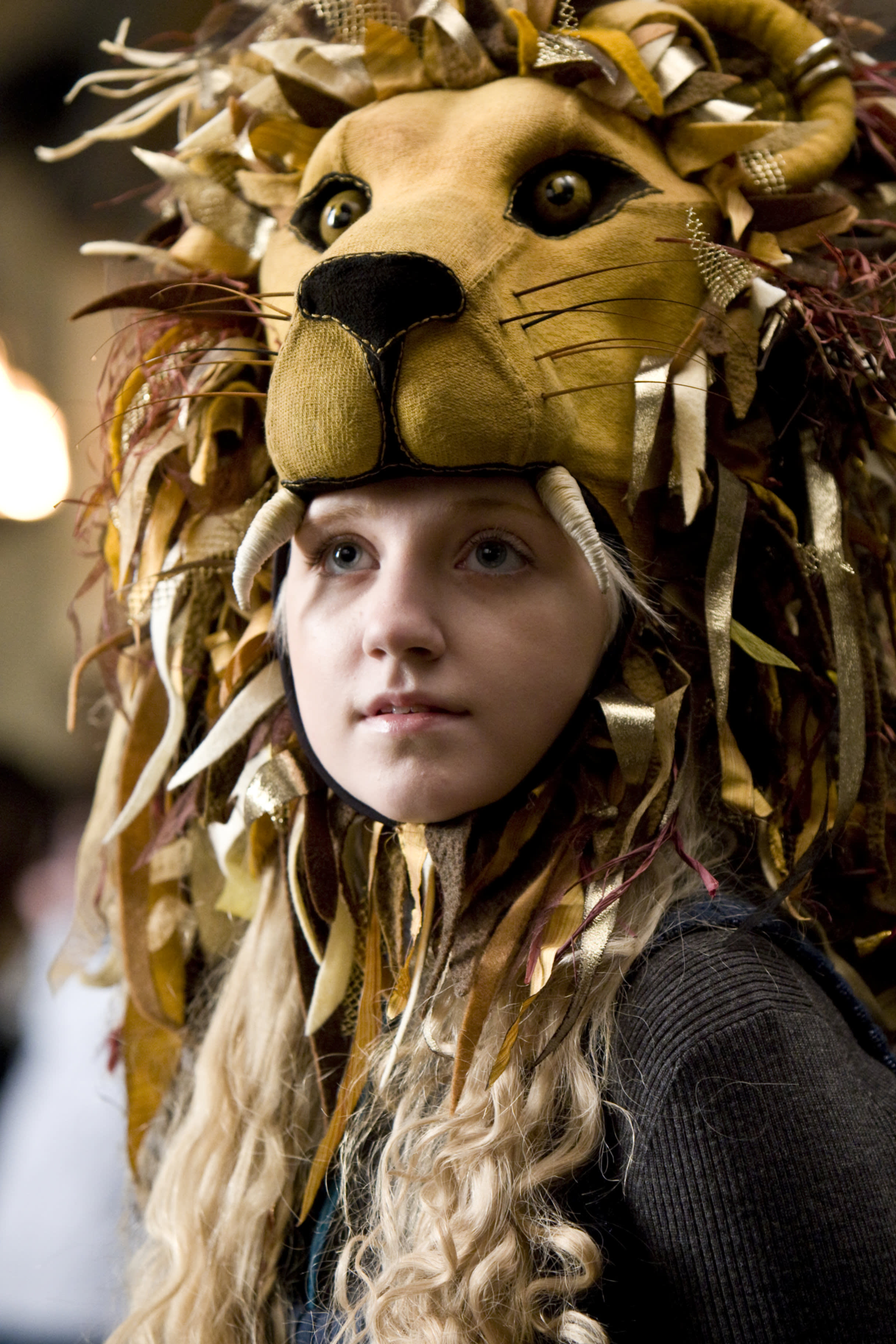 Luna wearing her roaring Gryffindor Lions Head  