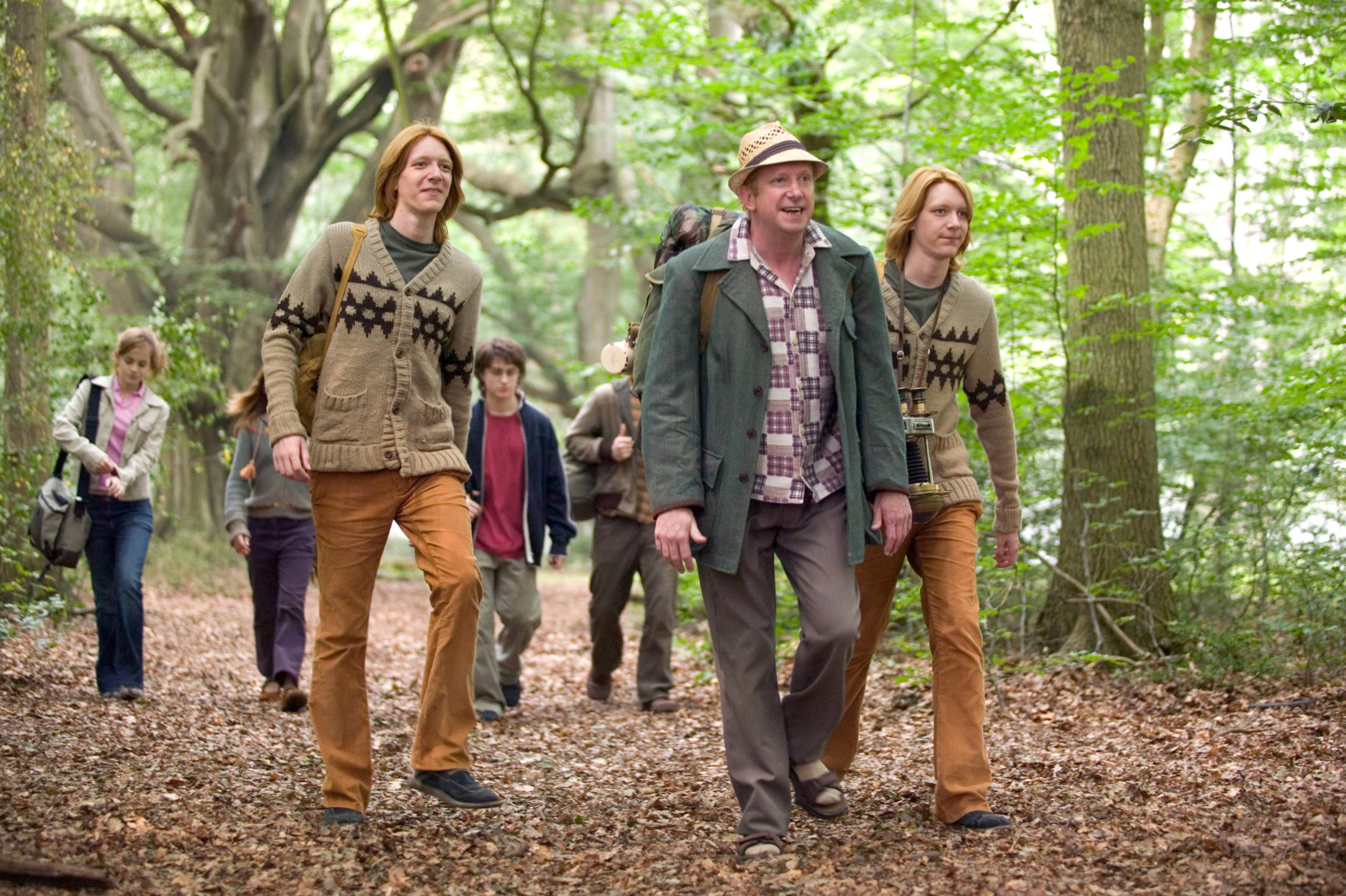 Arthur Weasley leads the group to the Portkey.