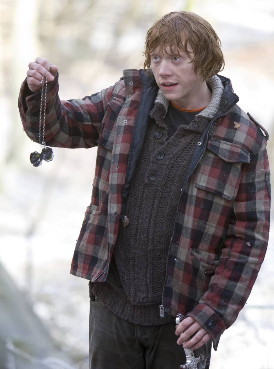 Ron holding up the destroyed locket Horcrux.
