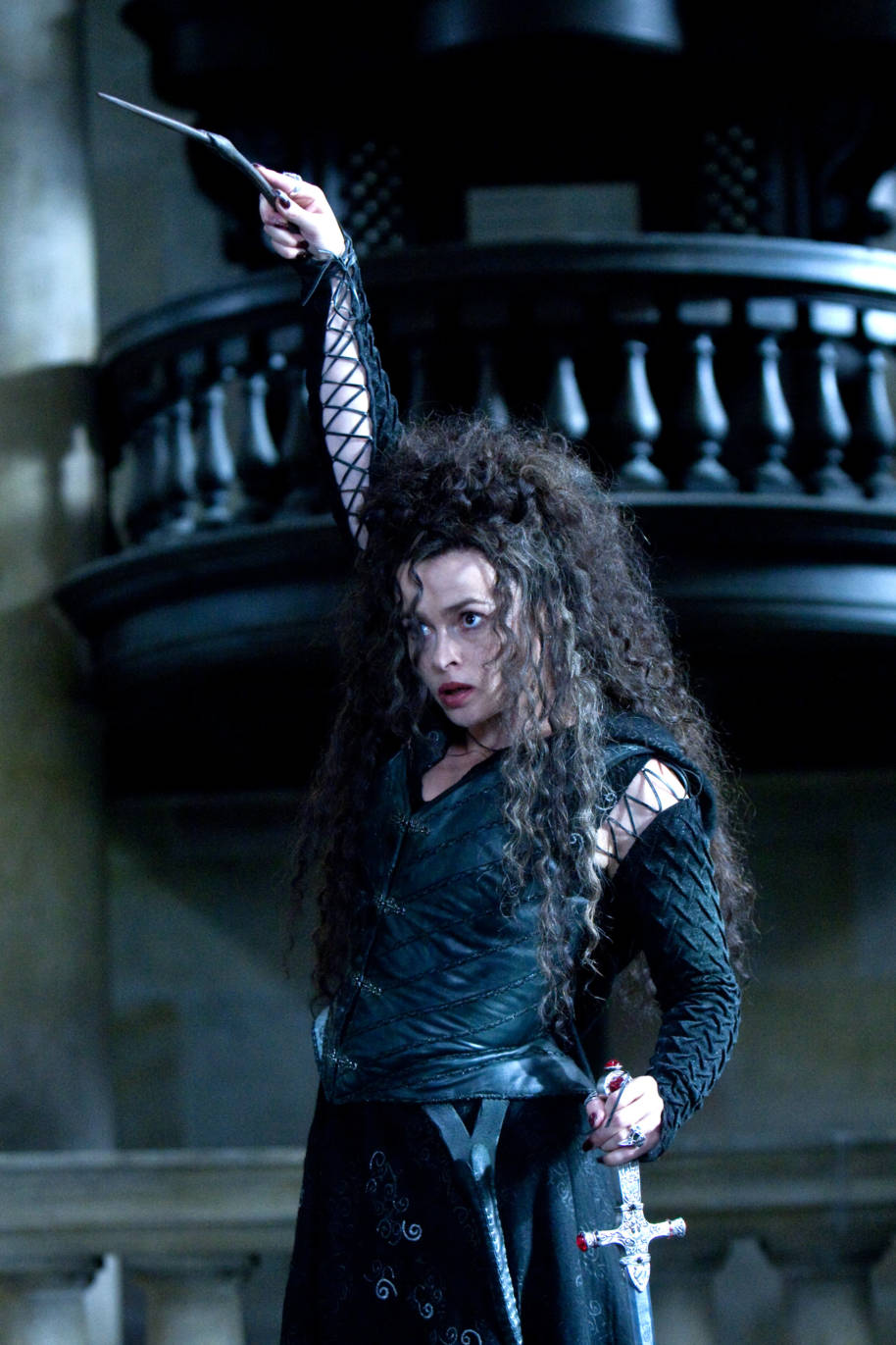 Bellatrix casting a spell and holding the Sowrd of Gryffindor 