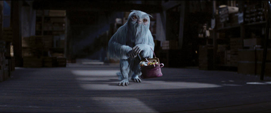 Dougal the Demiguise walking while carrying a handbag with trinkets inside