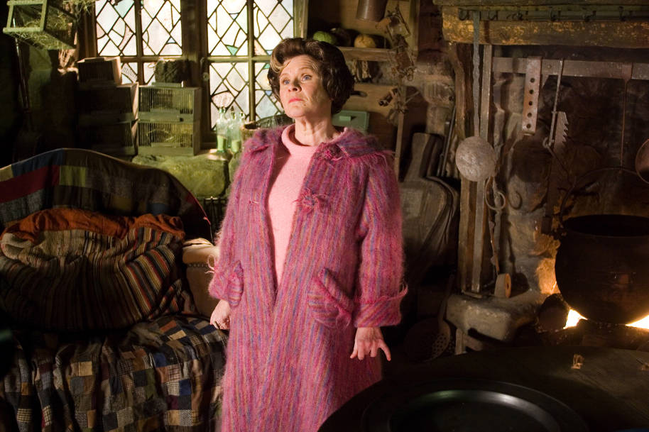 Dolores Umbridge is standing in Hagrid's hut and looking defiant.