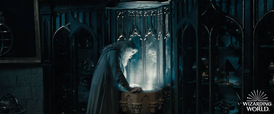 Dumbledore in his office looking into his Pensieve