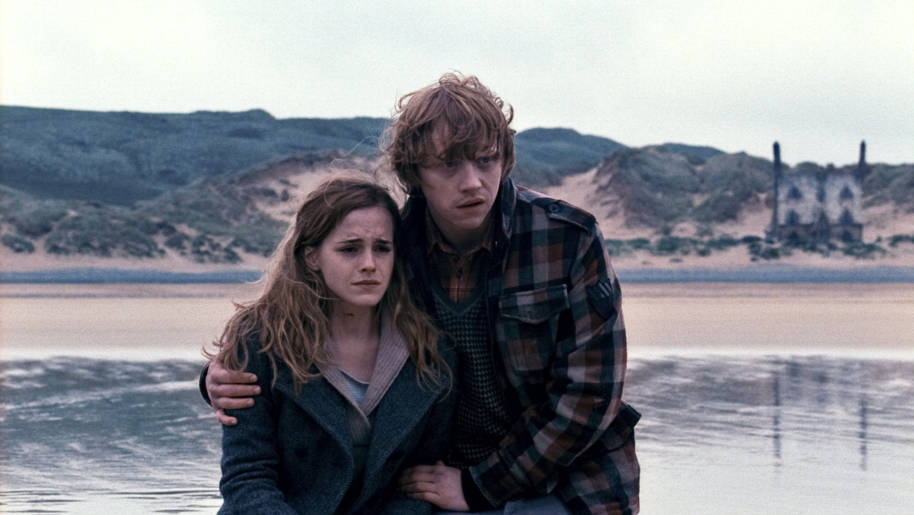 Ron holding a crying Hermione at Shell Cottage 