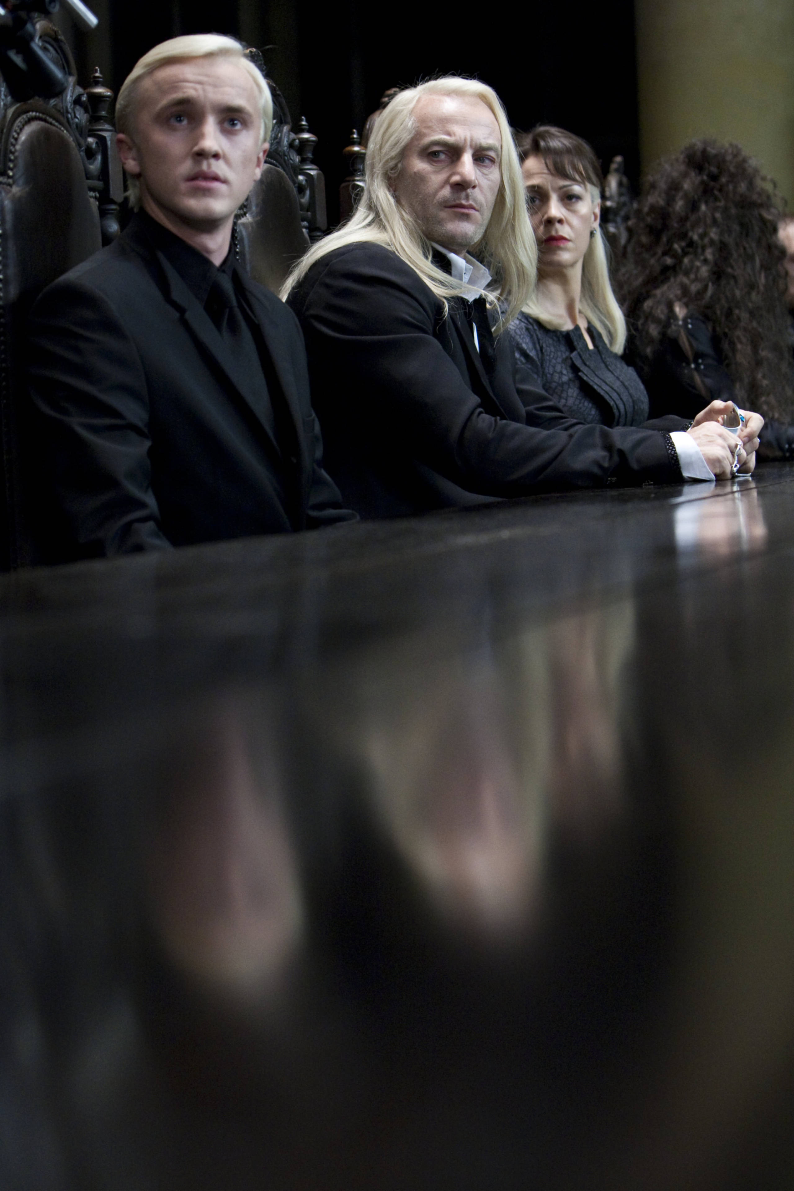 Lucius, Narcissa and Draco look scared at Voldemort's table in Malfoy Manor