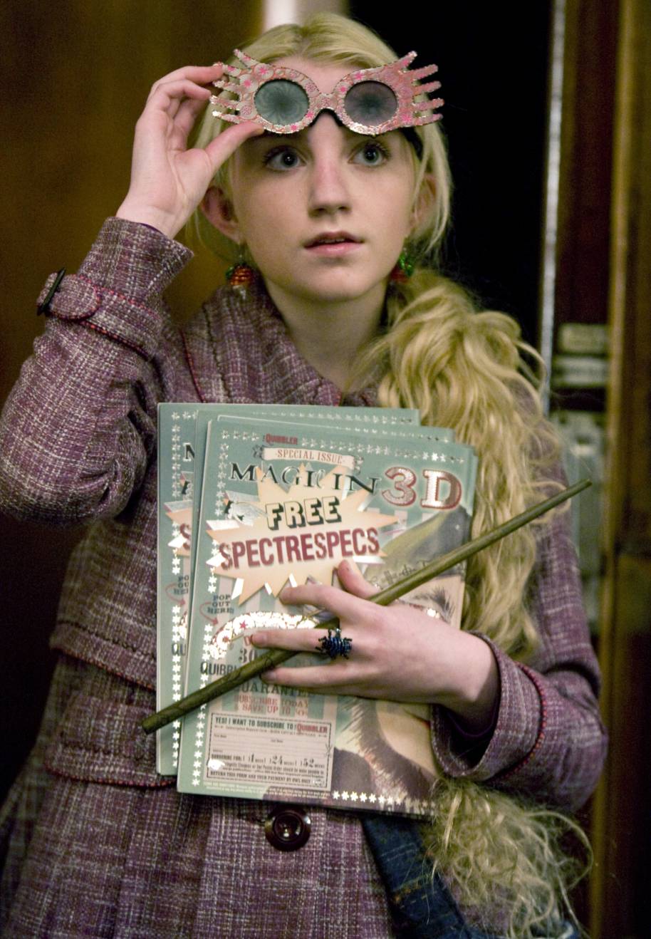 Luna with her Spectre Specs holding the Quibbler  