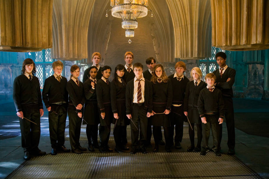 The members of Dumbledore's Army standing together in the Room of Requirement