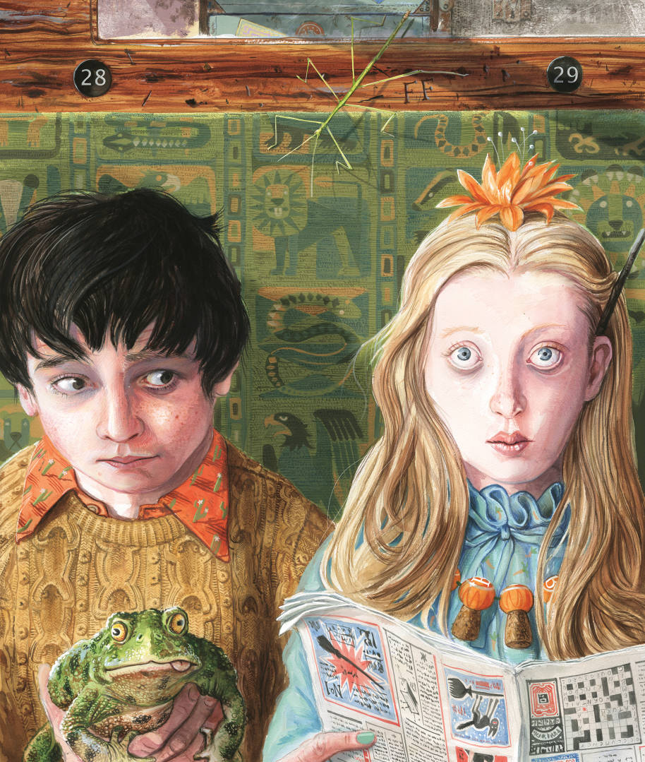 Luna and Neville sat on the Hogwarts Express. Luna is reading The Quibbler upside down and Neville is holding Trevor.