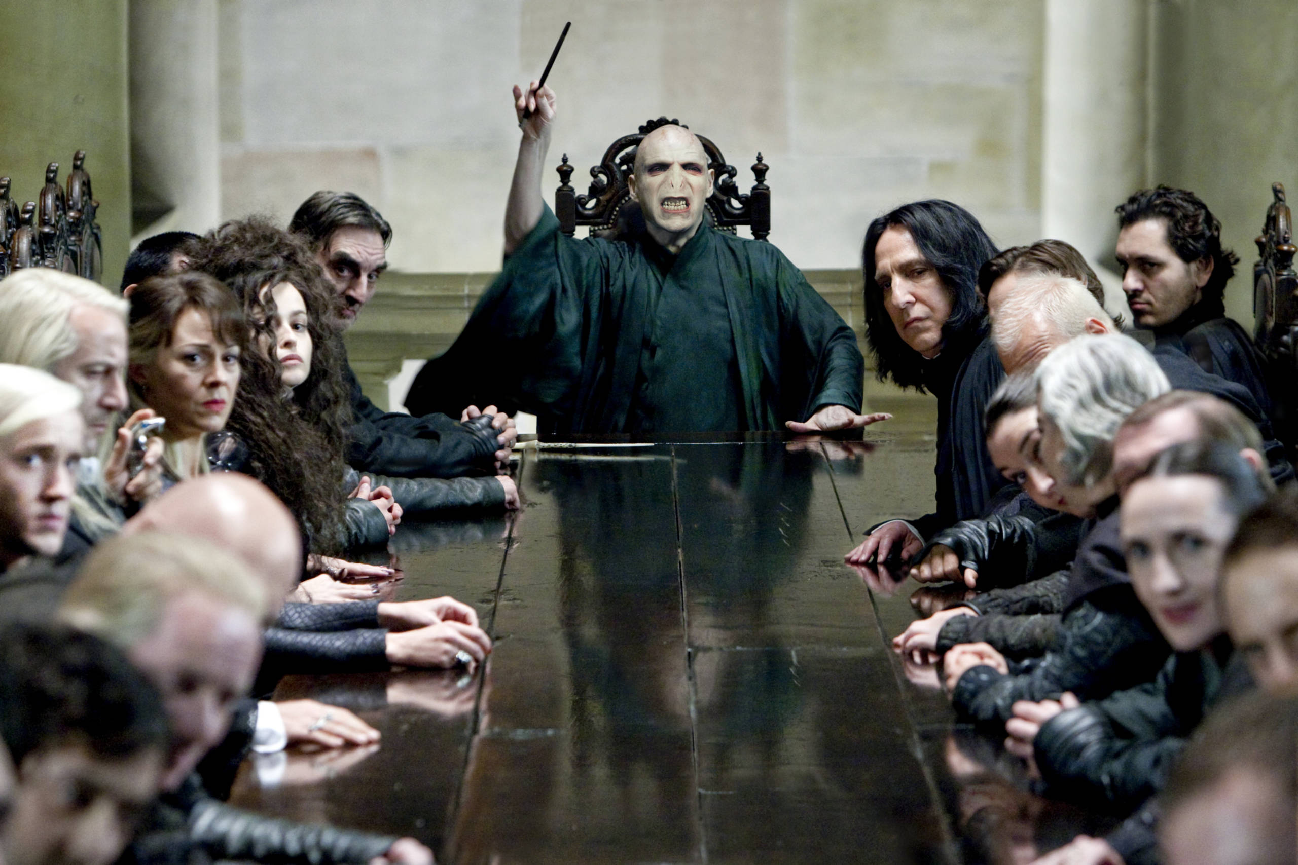 Voldemort casts a spell in front of his Death Eaters at Malfoy Manor in a film still from The Deathly Hallows Part 1 