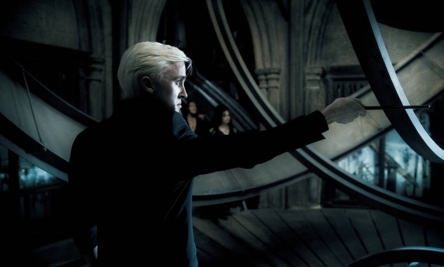 Draco Malfoy attempts to attack Dumbledore under Lord Voldemort's instruction.