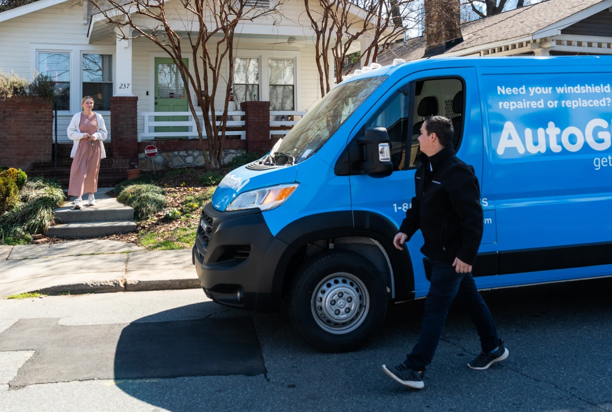 Auto Glass Now mobile service van parked at a home