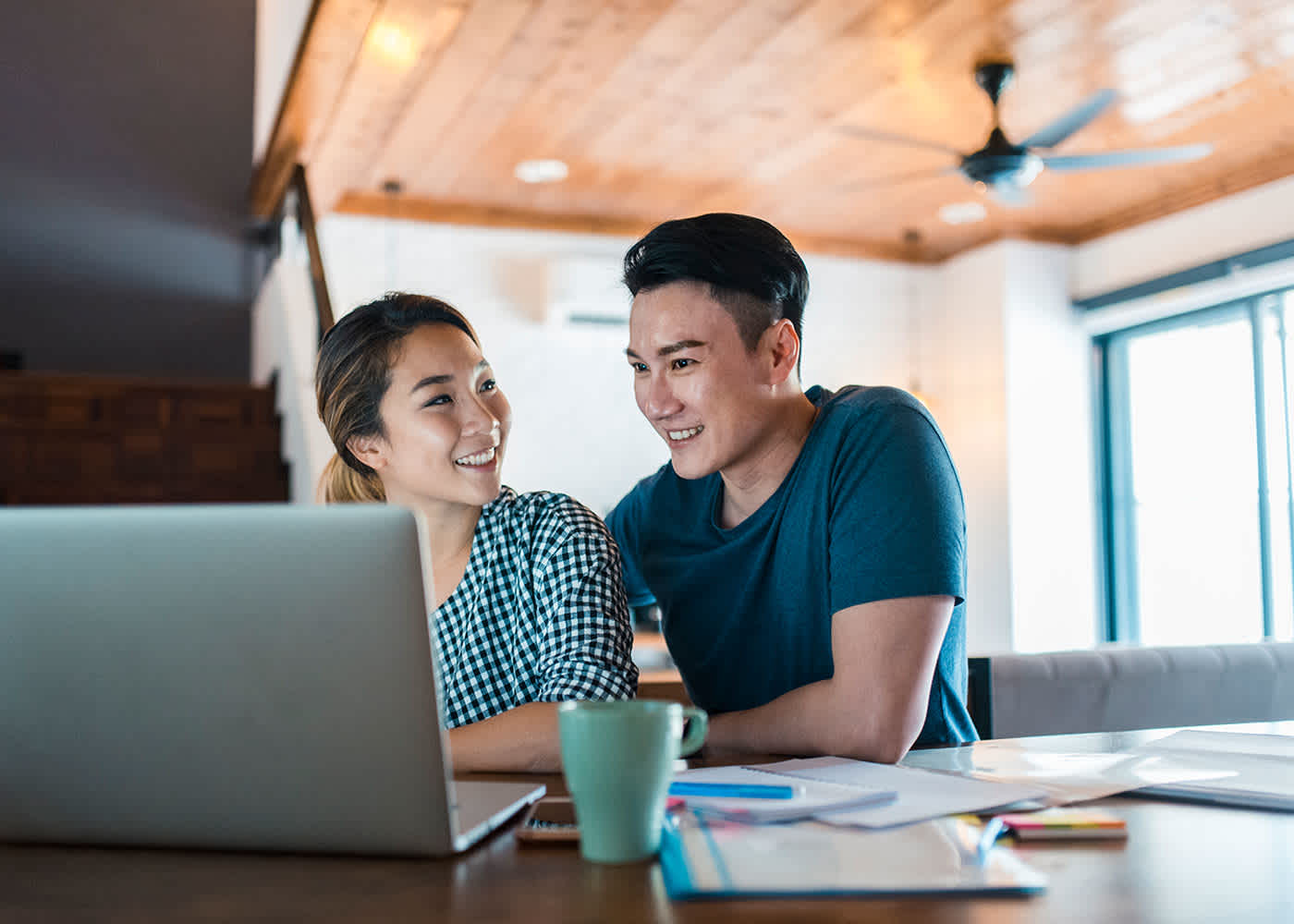 Man and woman doing research and discussing thought leadership
