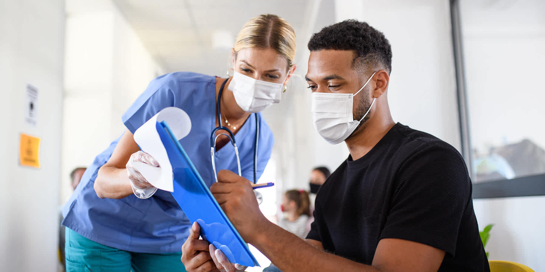 Man reading over vaccine paperwork and asking provider how effective the HPV vaccine is