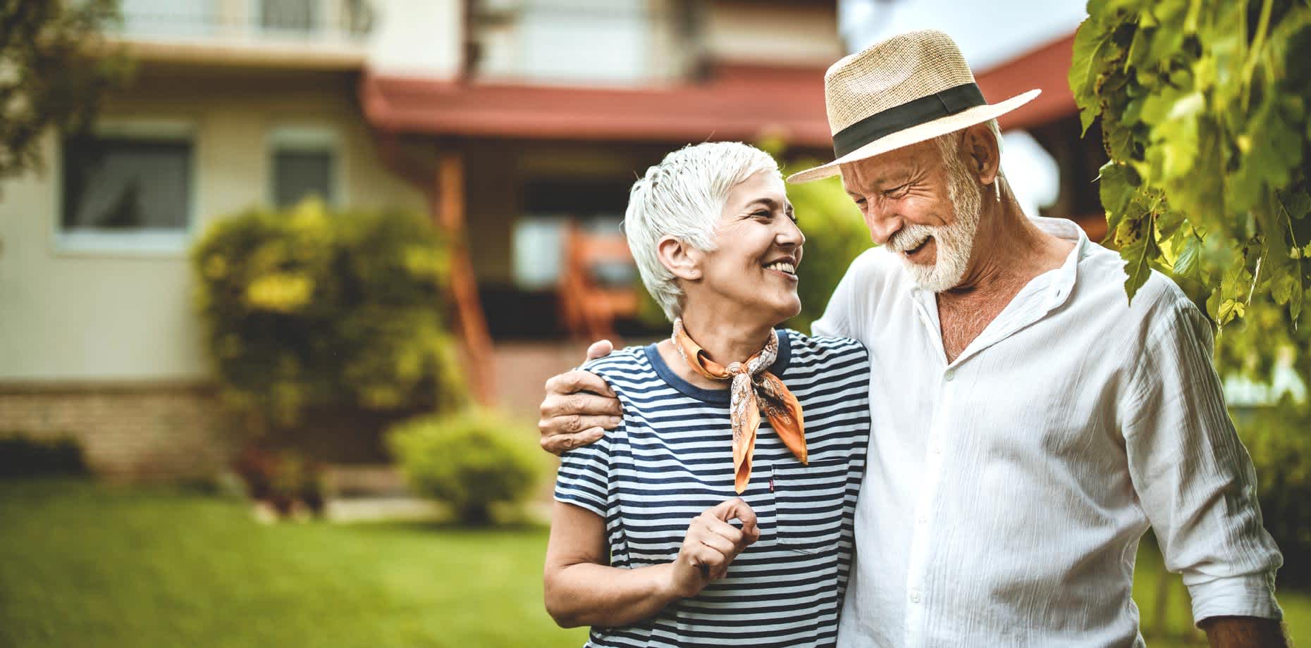 Smiling senior couple going on a walk while talking about STDs in older adults