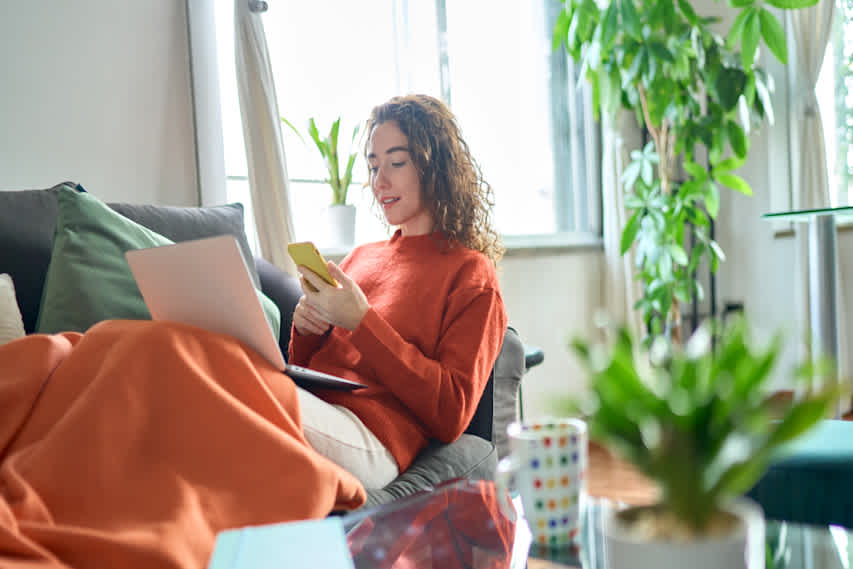 woman on couch on phone