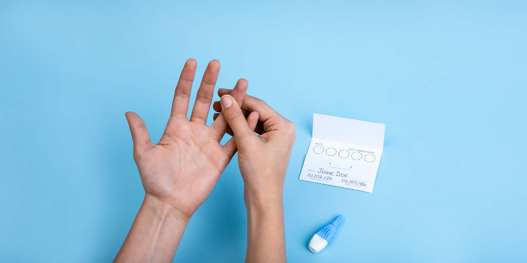 Person preparing to collect finger prick blood sample while wondering how high blood sugar affects the heart