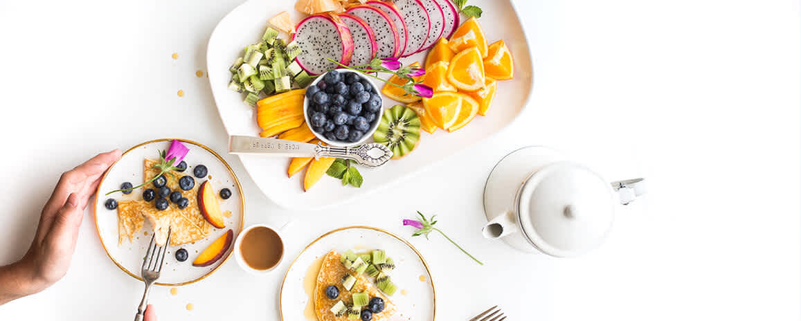 Image of person eating breakfast foods to represent fad diets