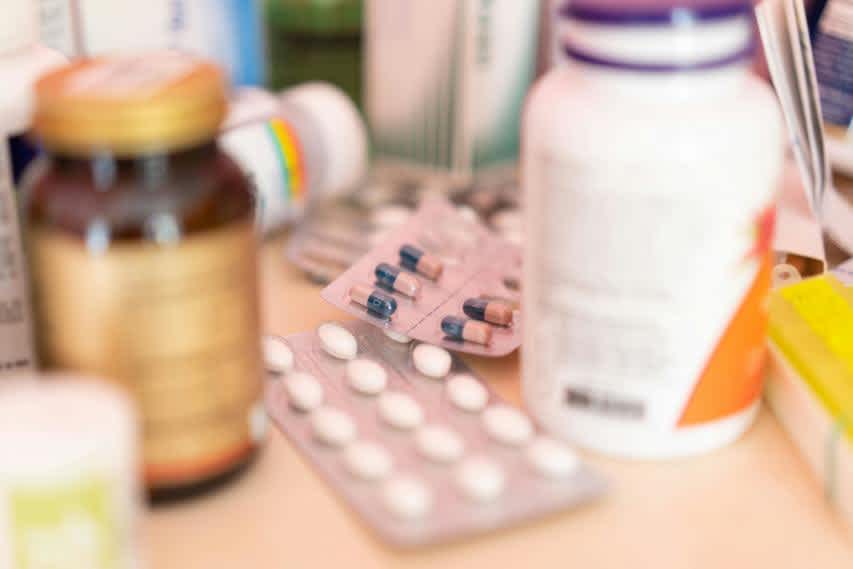 assorted medicine bottles on a counter