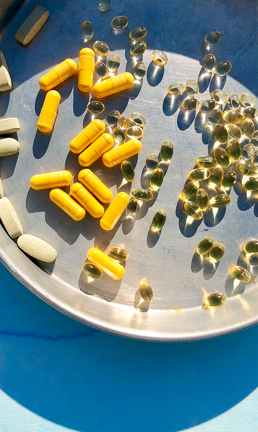Plate filled with folic acid supplements