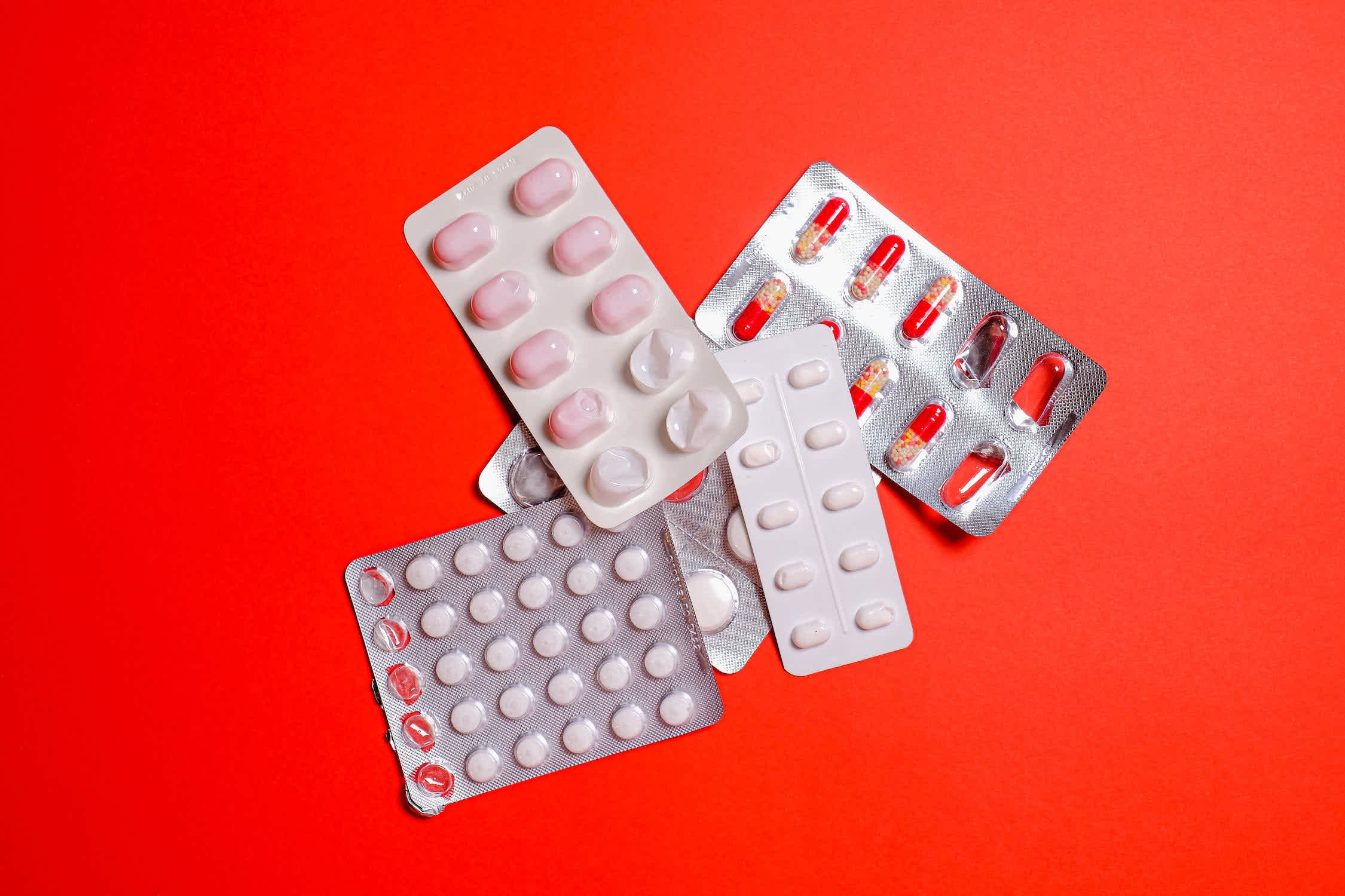 Package of medications for treating bacterial vaginosis (BV) against a red background