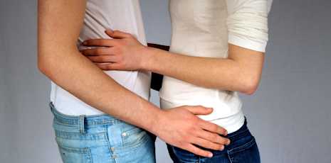 Couple holding each other intimately