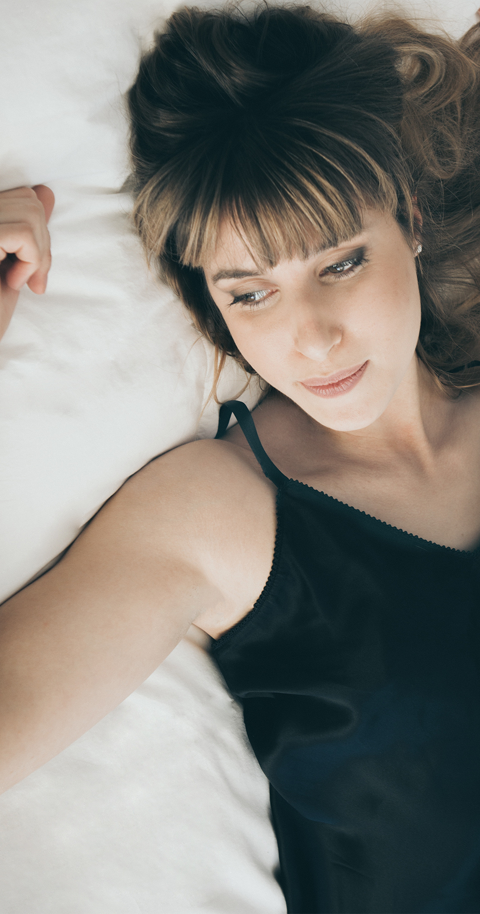Woman lying in bed thinking about ovarian reserve