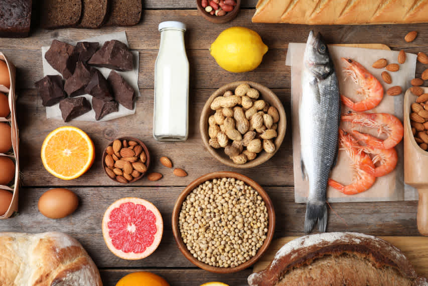 food flat lay of common allergens like milk and peanuts