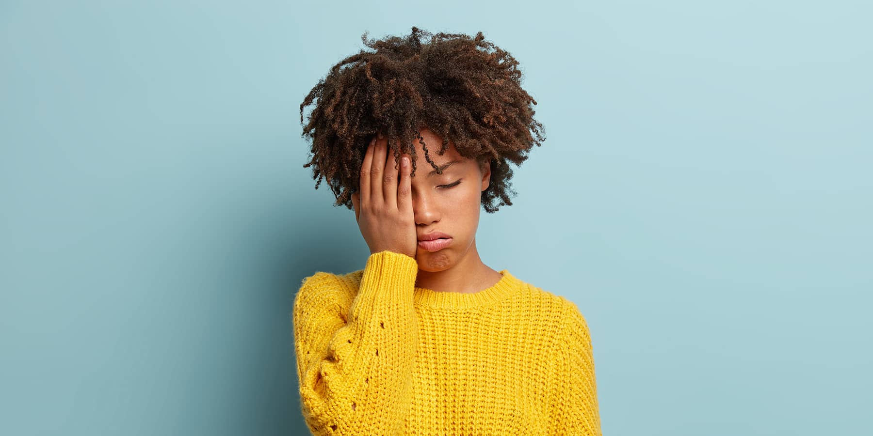 Woman experiencing fatigue due to B12 deficiency and wondering how long it takes to recover