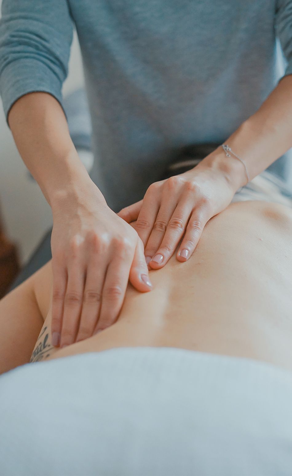 Person receiving a back massage to aid in inflammation