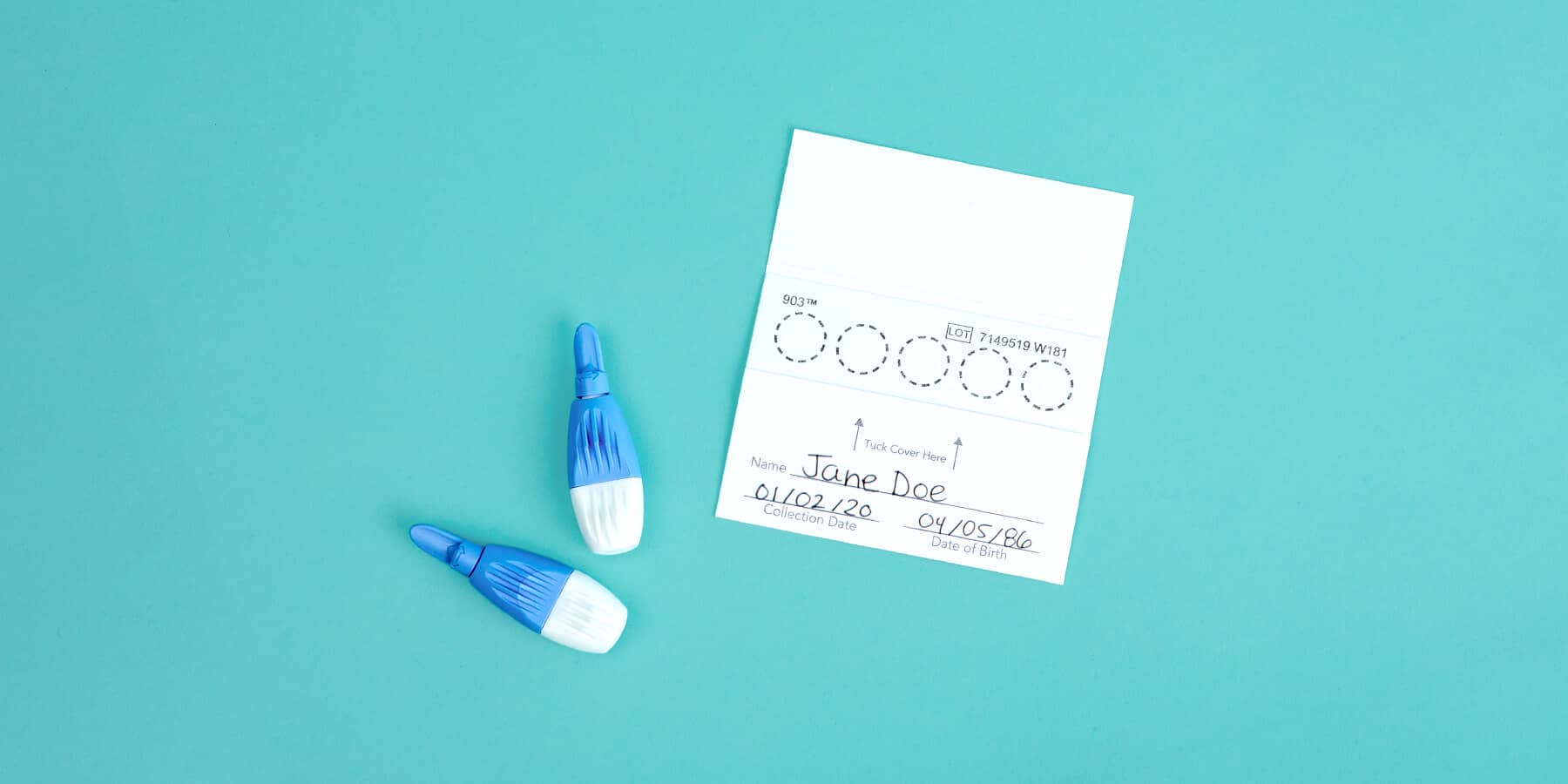 Finger prick blood collection lancets next to dried blood spot sample card for A1c testing